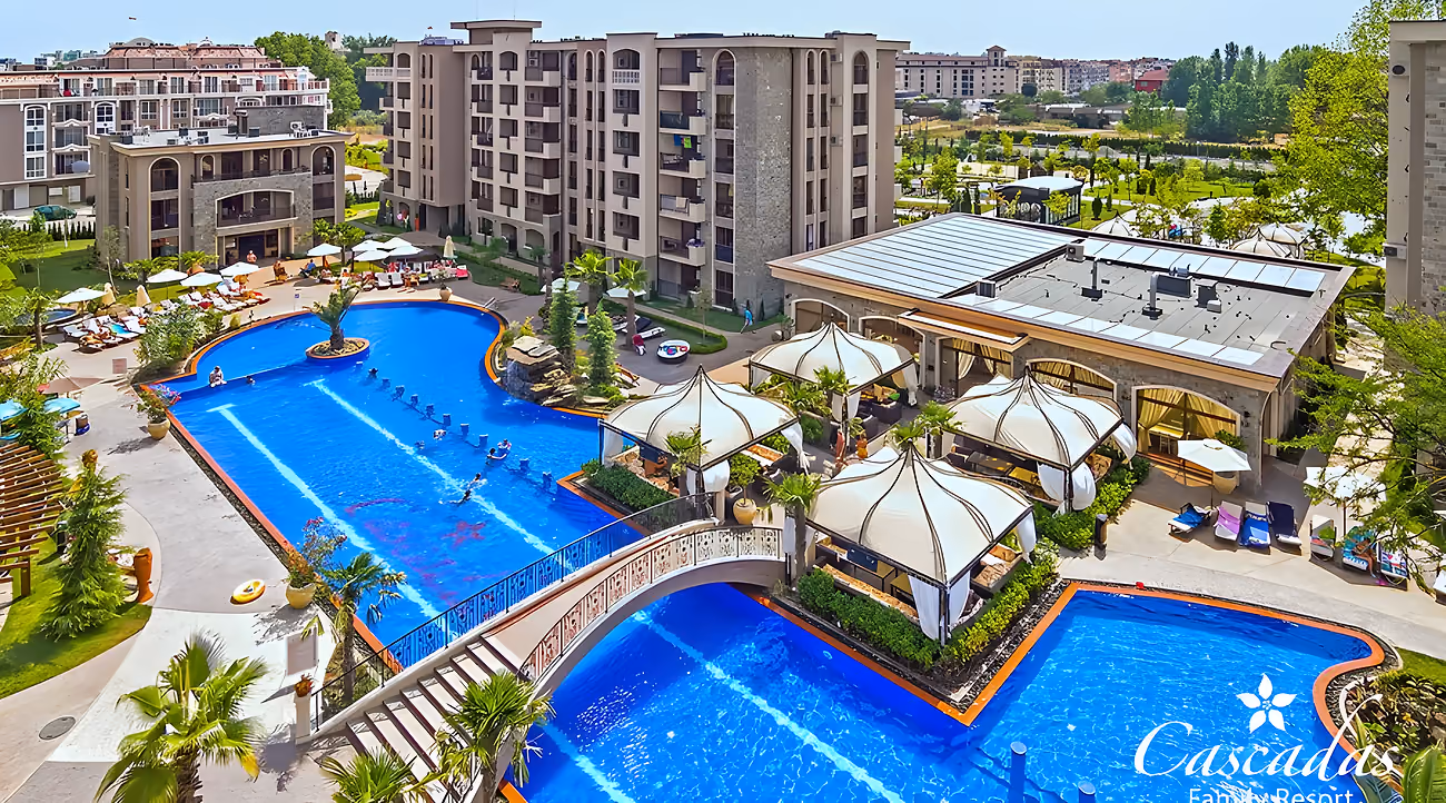 An aerial view of the linked pools, the bridge over the water and the canopies